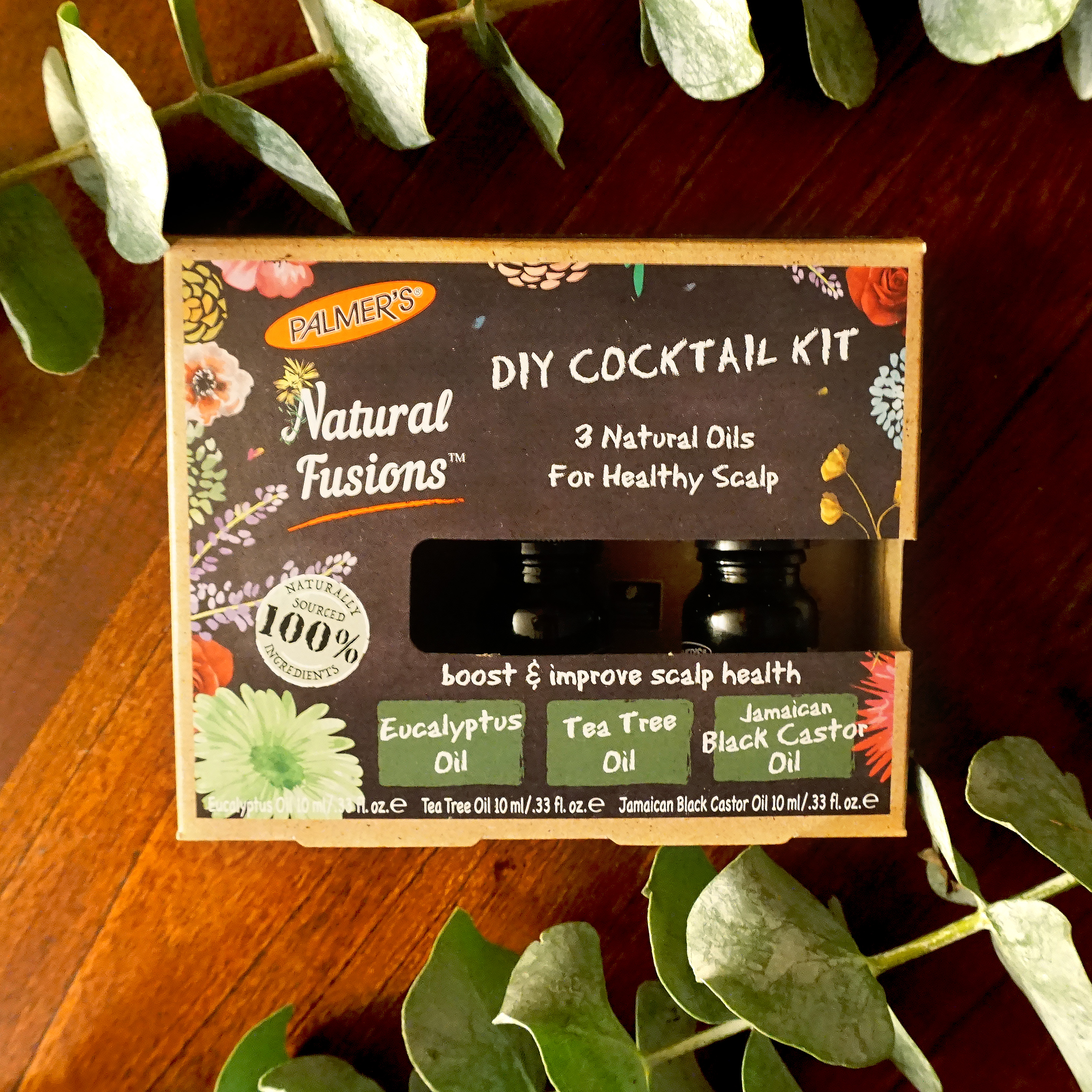 Palmer's Natural Fusions DIY Healthy Scalp Cocktail Kit on a table with flowers