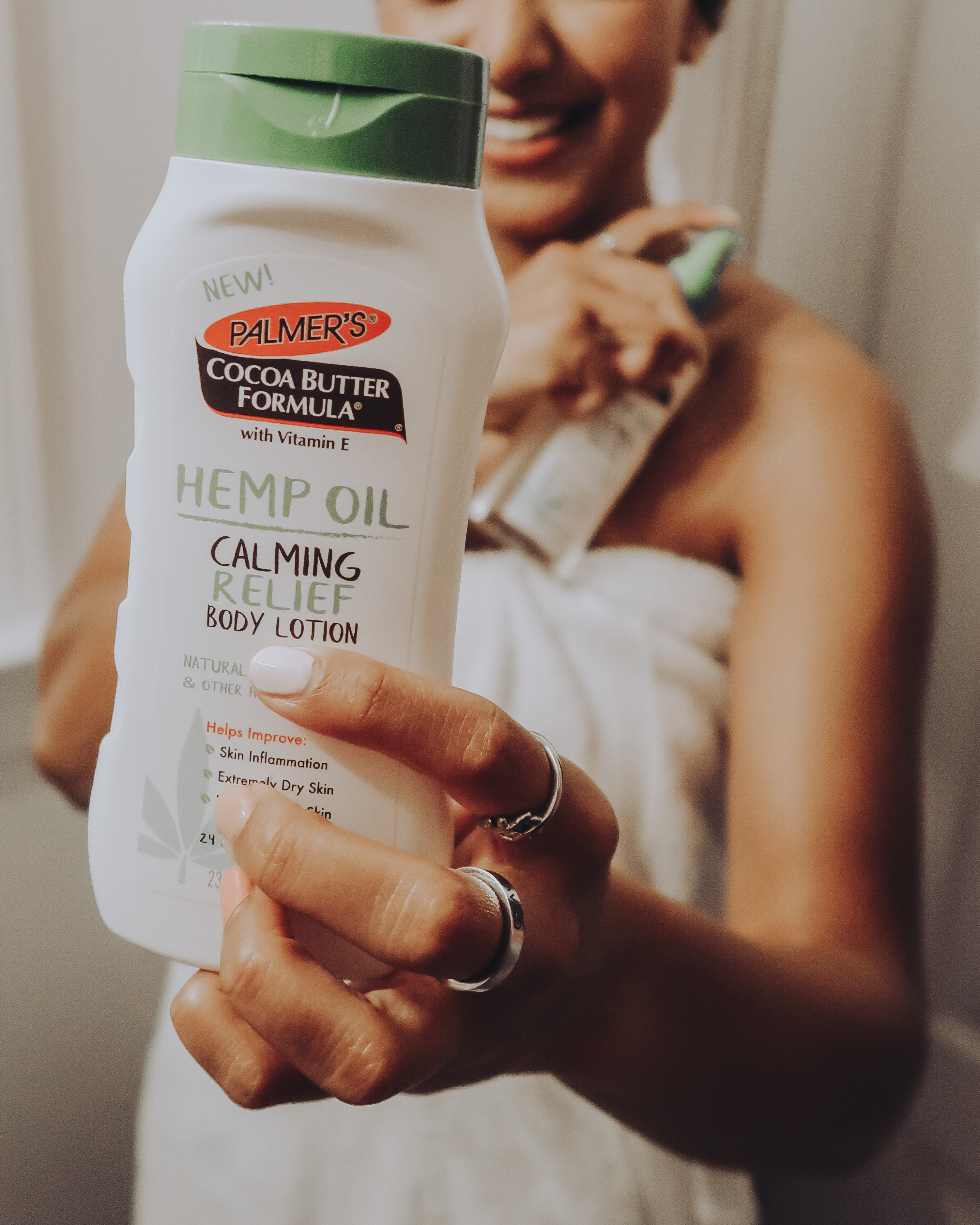 Palmer's Hemp Oil Calming Relief Body Lotion for dry, irritated skin in hand