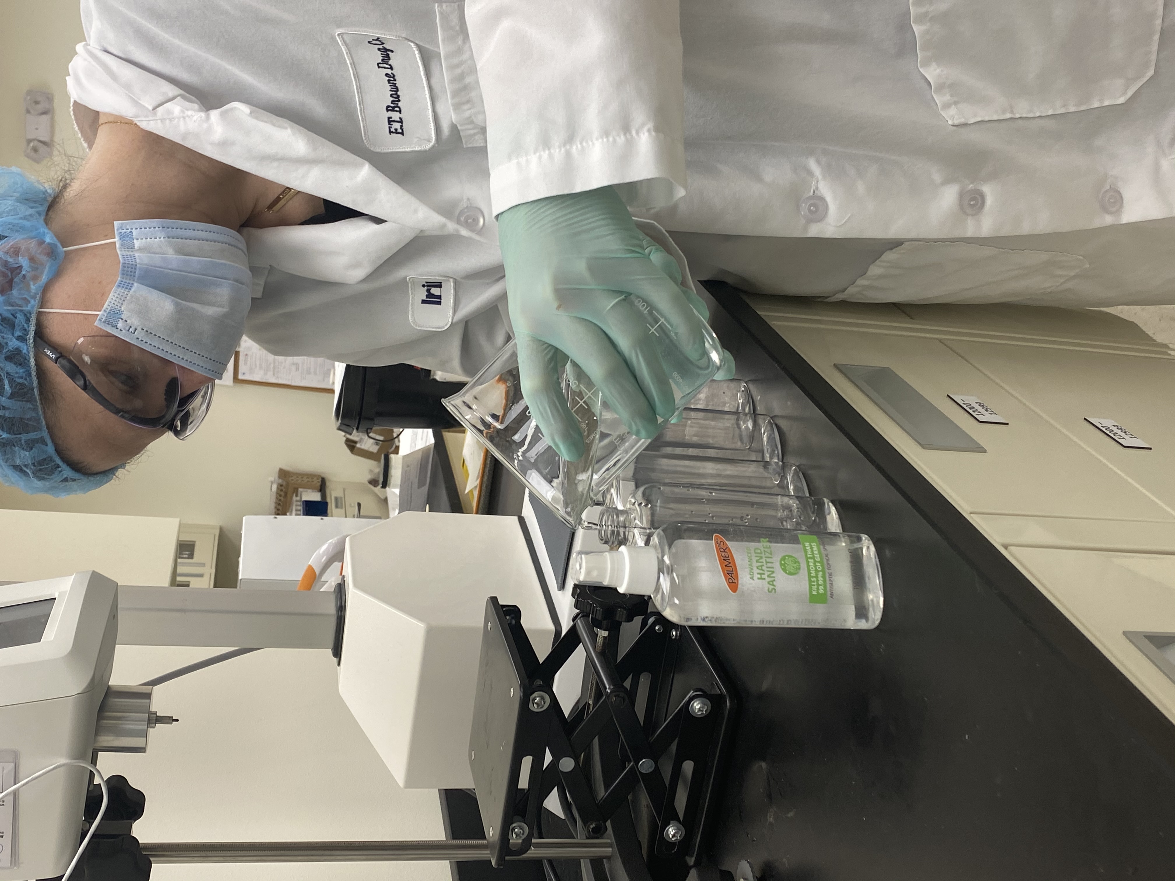 Palmer's Hand Sanitizer being poured into bottles