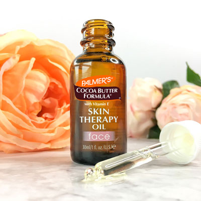 Palmer's Skin Therapy Face Oil, the best oil for dry skin, on table with dropper in front