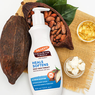 Should you use Body Oil or Body Lotion first? Palmer's Cocoa Butter Formula Body Lotion on table with ingredients