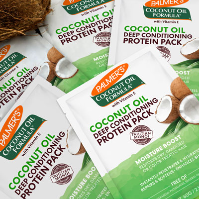 Palmer's Coconut Oil Protein Packs, for nourishing box braids with curls, in a pile