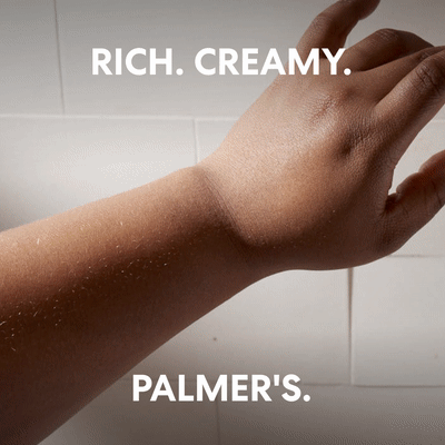 Palmer's Cocoa Butter for Sunburn Lotion being applied to arm