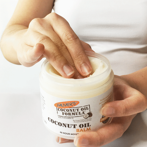 Palmer's Coconut Balm, the best cuticle balm, being applied to cuticles
