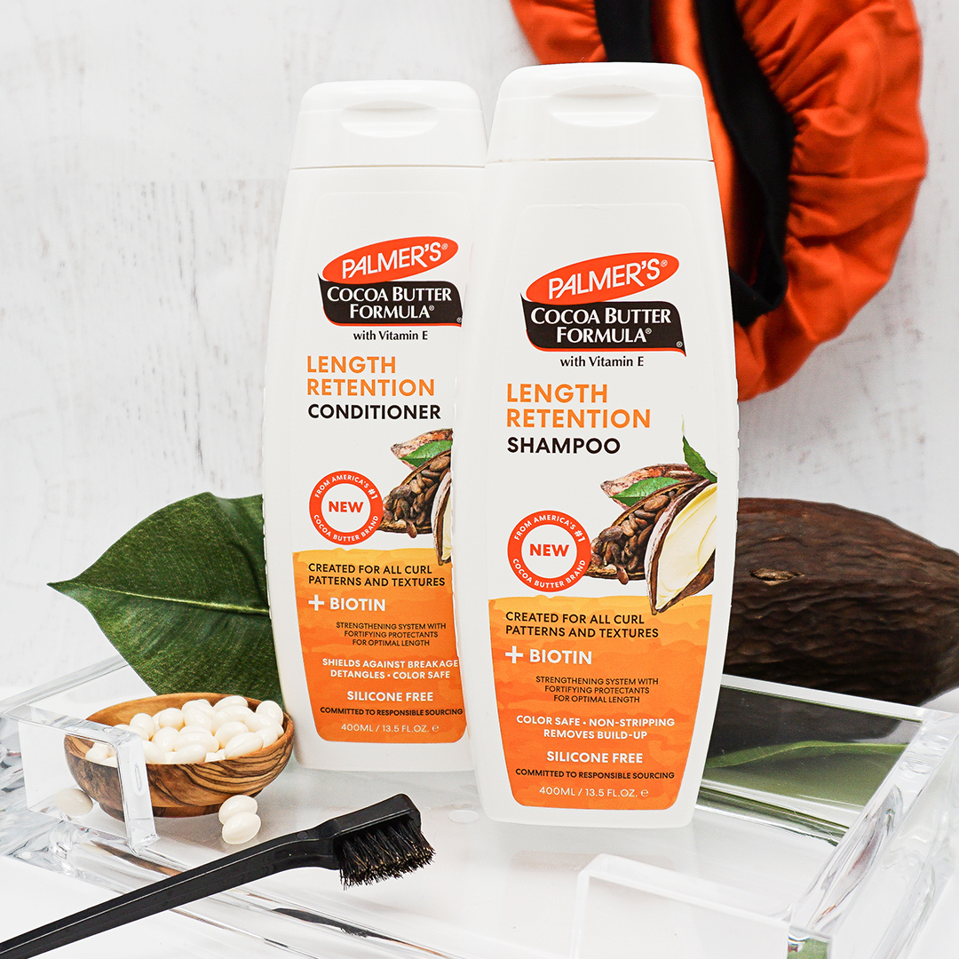 Palmer's Cocoa Butter Formula Length Retention Shampoo & Conditioner for protective styles for sleeping on vanity with brush