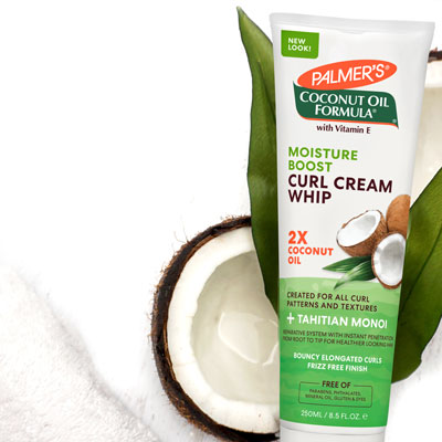 One of the best hair treatment tips for winter, Palmer's Coconut Oil Formula Moisture Boost Curl Cream Whip with coconuts