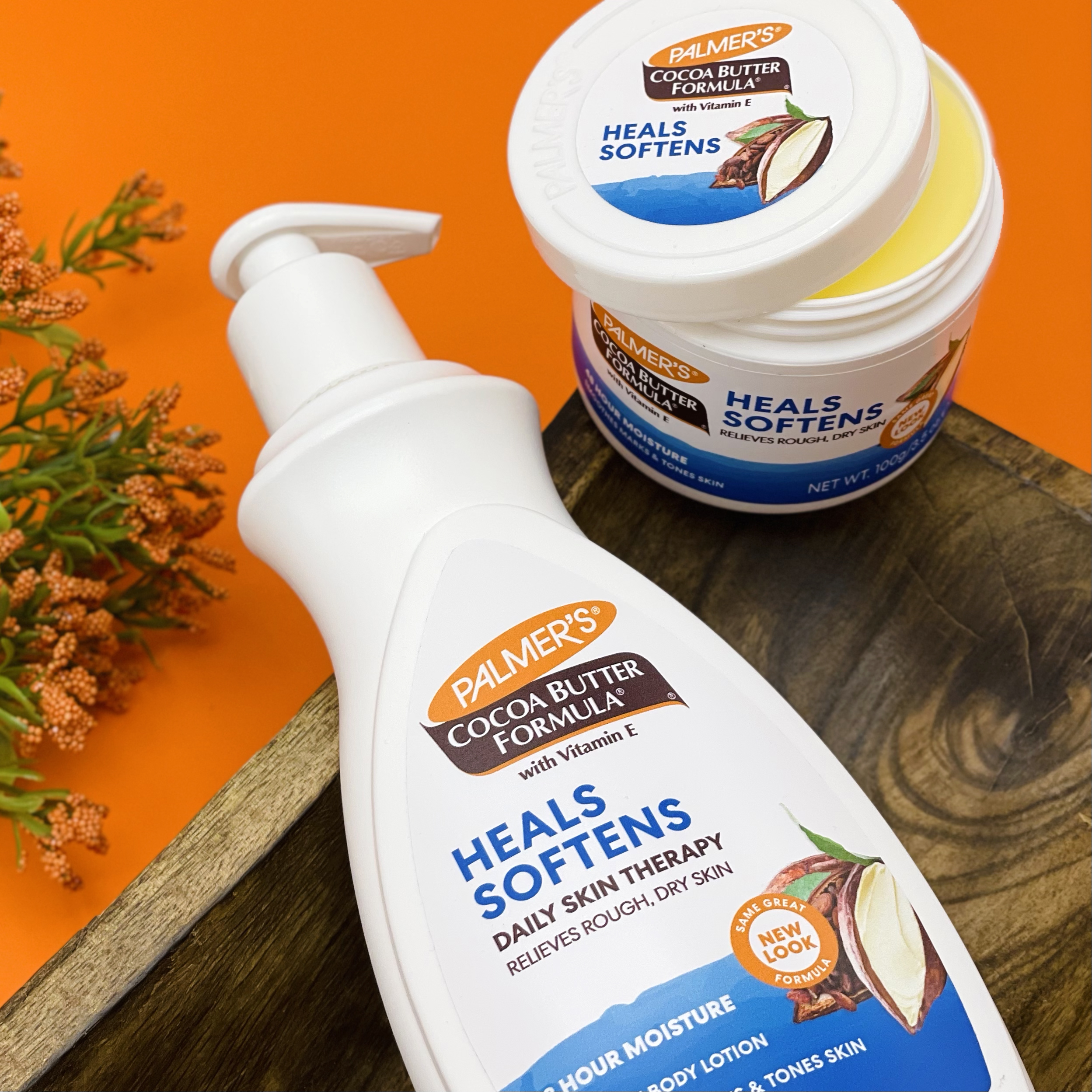 Palmer's Cocoa Butter Lotion and Original Solid Jar, the perfect additions to your winter skincare routine, on a table