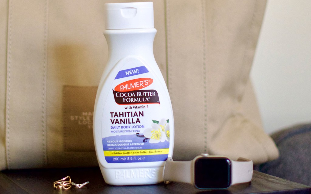 Palmer's Tahitian Vanilla Body Lotion on table with Apple Watch and Large Bag