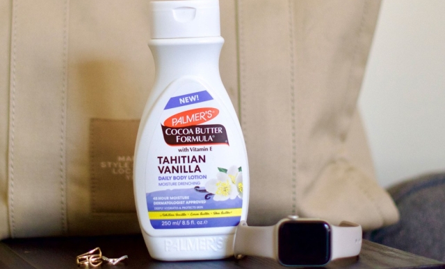 Palmer's Tahitian Vanilla Body Lotion on table with Apple Watch and Large Bag