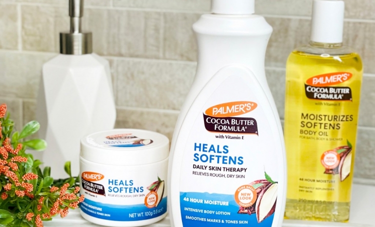 Palmer's Cocoa Butter Formula products for your extreme cold weather skin care routine on a vanity 
