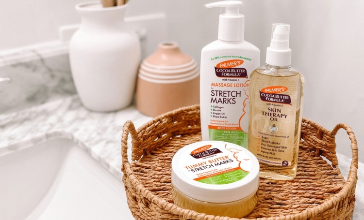 Palmer's Stretch Marks after pregnancy products in a woven tray on bathroom vanity